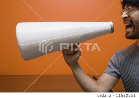 Man yelling into megaphone 11630553