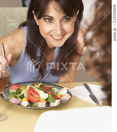 Hispanic woman eating salad Hispanic woman eating salad 11630606