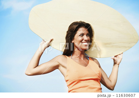Young woman holding boogie board 11630607