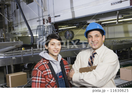 Man and woman together in warehouse 11630625