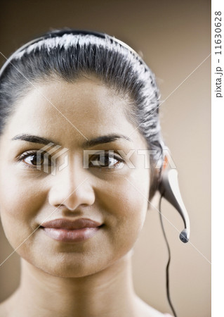 Indian businesswoman wearing headset 11630628