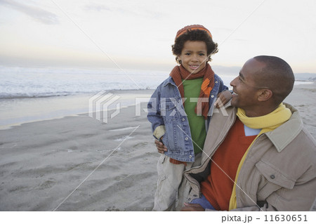 African man with son on the beach African man with son on the beach 11630651
