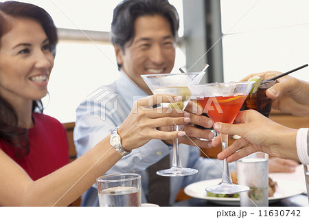 Multi-ethnic friends toasting at restaurant Multi-ethnic friends toasting at restaurant 11630742