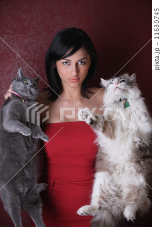 Young woman holding her cats 11630745