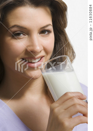 Woman drinking glass of milk Woman drinking glass of milk 11630884