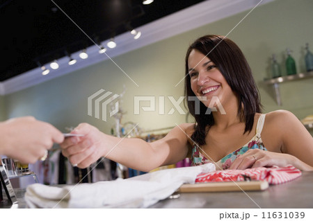 Hispanic woman clothing shopping Hispanic woman clothing shopping 11631039
