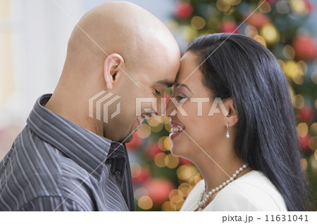 Hispanic couple touching noses Hispanic couple touching noses 11631041
