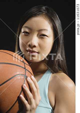 Asian woman holding basketball Asian woman holding basketball 11631073