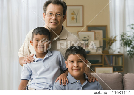 Father and sons smiling for the camera Father and sons smiling for the camera 11631114