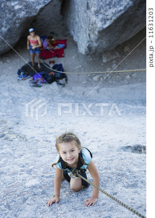 Asian girl rock climbing Asian girl rock climbing 11631203
