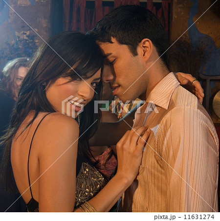 Multi-ethnic couple dancing at nightclub Multi-ethnic couple dancing at nightclub 11631274