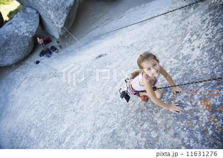 Asian girl rock climbing Asian girl rock climbing 11631276