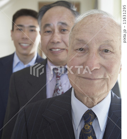 Senior Asian man with family members in background  11631295