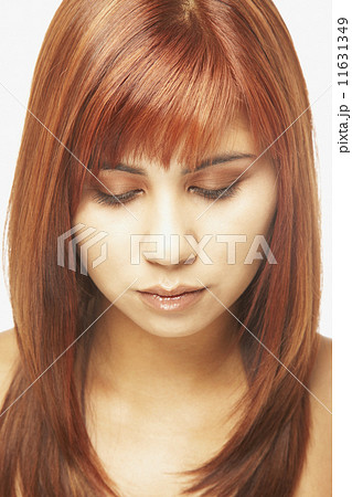 Asian woman looking down 11631349