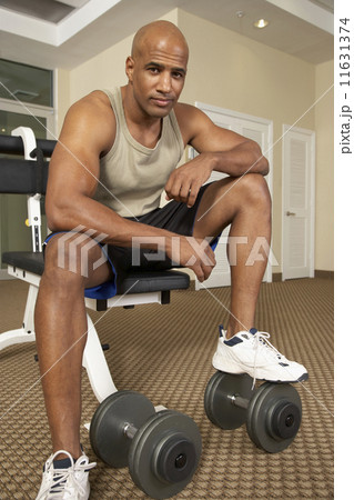 Mixed Race man at health club 11631374