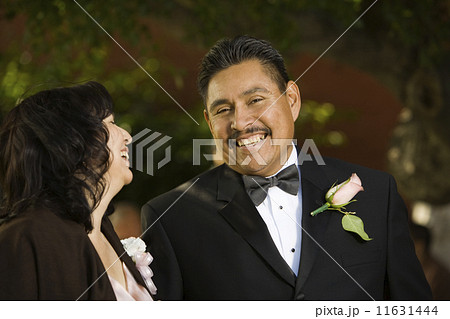 Hispanic couple in evening wear 11631444