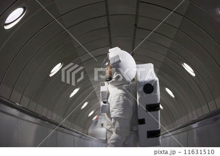 Astronaut using an escalator 11631510