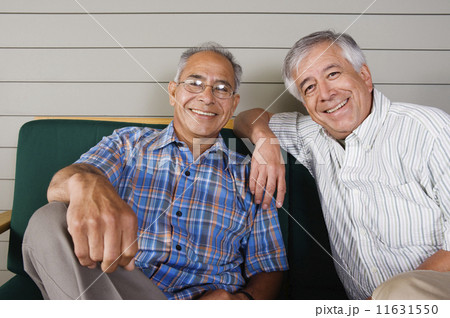 Portrait of two elderly men sitting and smiling Portrait of two elderly men sitting and smiling 11631550