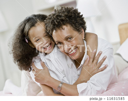 African mother and daughter hugging 11631585