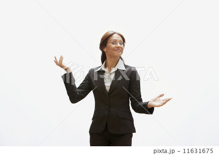 Hispanic businesswoman with arms out 11631675