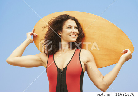 Young woman holding boogie board Young woman holding boogie board 11631676