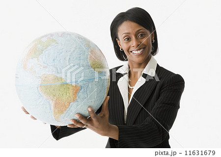 African businesswoman holding globe African businesswoman holding globe 11631679