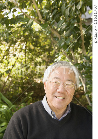 Senior Asian man smiling outdoors Senior Asian man smiling outdoors 11631707
