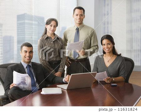 Hispanic businesspeople in conference room 11631824