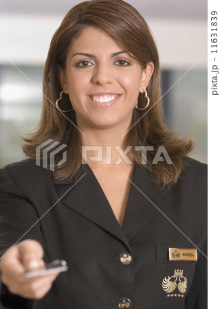 Hispanic woman handing back credit card 11631839