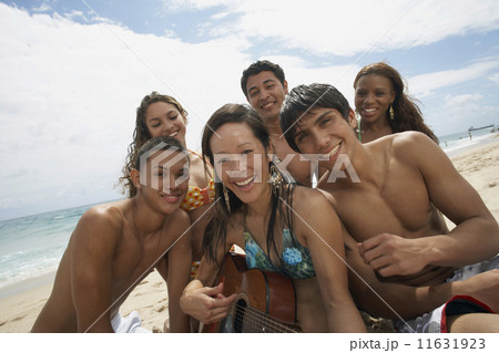 Multi-ethnic friends at beach 11631923