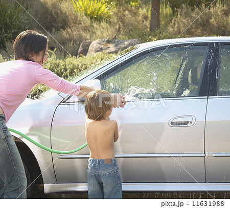Mother and young son washing car Mother and young son washing car 11631988