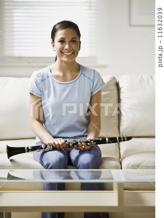 Asian girl holding clarinet 11632039