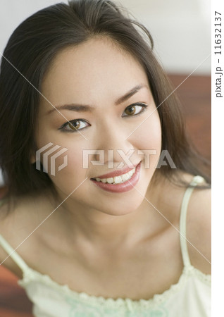 Close up of Asian woman smiling Close up of Asian woman smiling 11632137