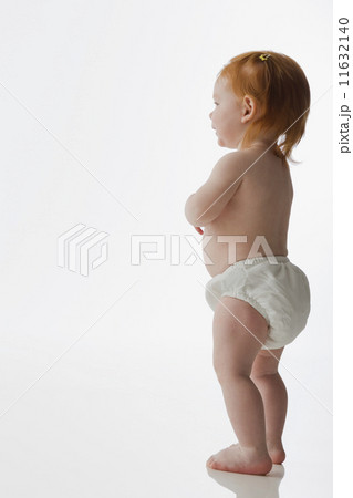Studio shot of baby standing Studio shot of baby standing 11632140