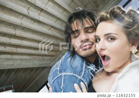 Hispanic couple hugging 11632155