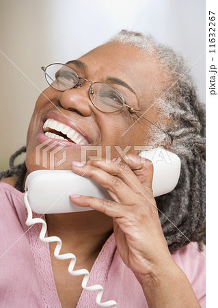 Close up of senior adult woman laughing on phone Close up of senior adult woman laughing on phone 11632267
