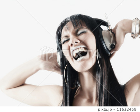 Pacific Islander woman listening to headphones 11632459