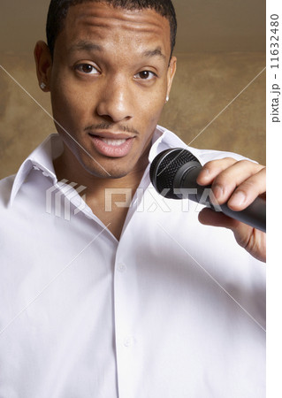 African man singing into microphone 11632480