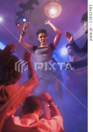 Asian woman dancing at nightclub 11632483