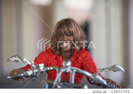 African woman on motorcycle African woman on motorcycle 11632541