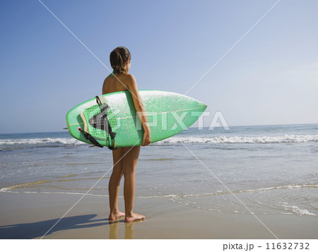 Hispanic girl holding surfboard Hispanic girl holding surfboard 11632732