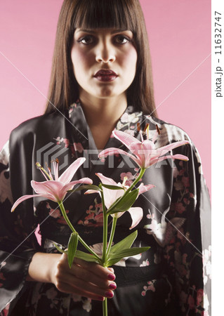 Middle Eastern woman holding flowers Middle Eastern woman holding flowers 11632747