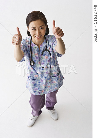 Asian female nurse giving thumbs up 11632749