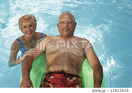 Multi-ethnic senior couple in swimming pool 11632816