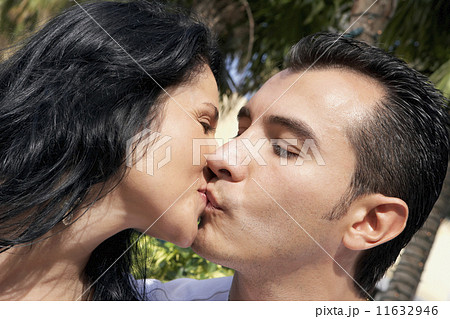 Hispanic couple kissing Hispanic couple kissing 11632946
