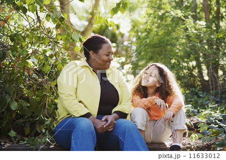African mother and daughter in woods 11633012