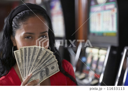 Hispanic woman holding money 11633113