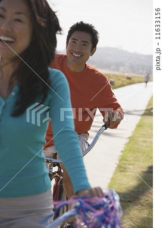 Asian couple riding bicycles 11633156