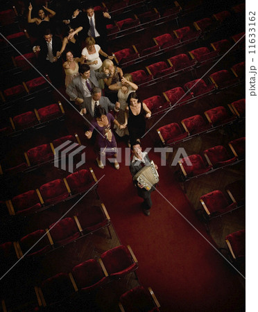 Hispanic people dancing in theatre aisle 11633162