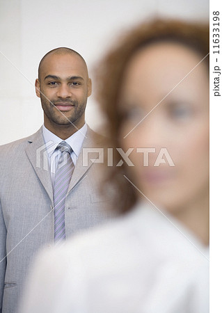 African businessman behind coworker 11633198